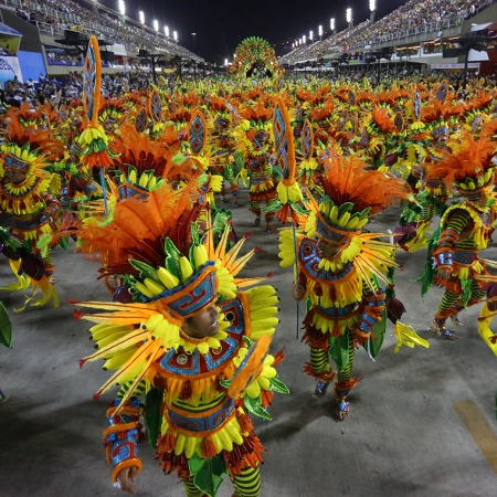 Take part in the real Samba Schools Parade during the legendary Rio de Janeiro Carnival.