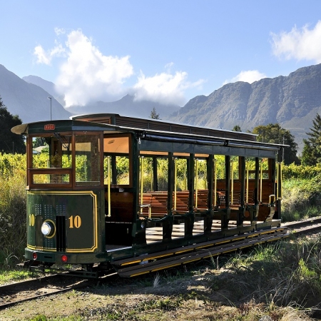 Journey with the Franschhoek Wine Tram hop-on hop-off tour through the Franschhoek Valley