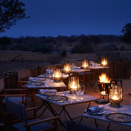 Enjoy traditional dinners in the bush while being entertained by African drummers